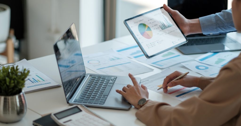 A laptop and a tablet on a desk